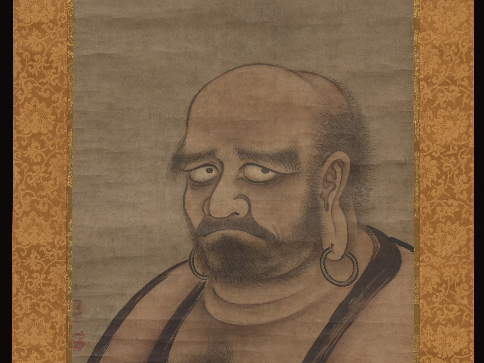 Bodhidharma looks sharply to one side in Kano Masanobu's ink portrait, his complete bald head, beard and earrings clearly visible.