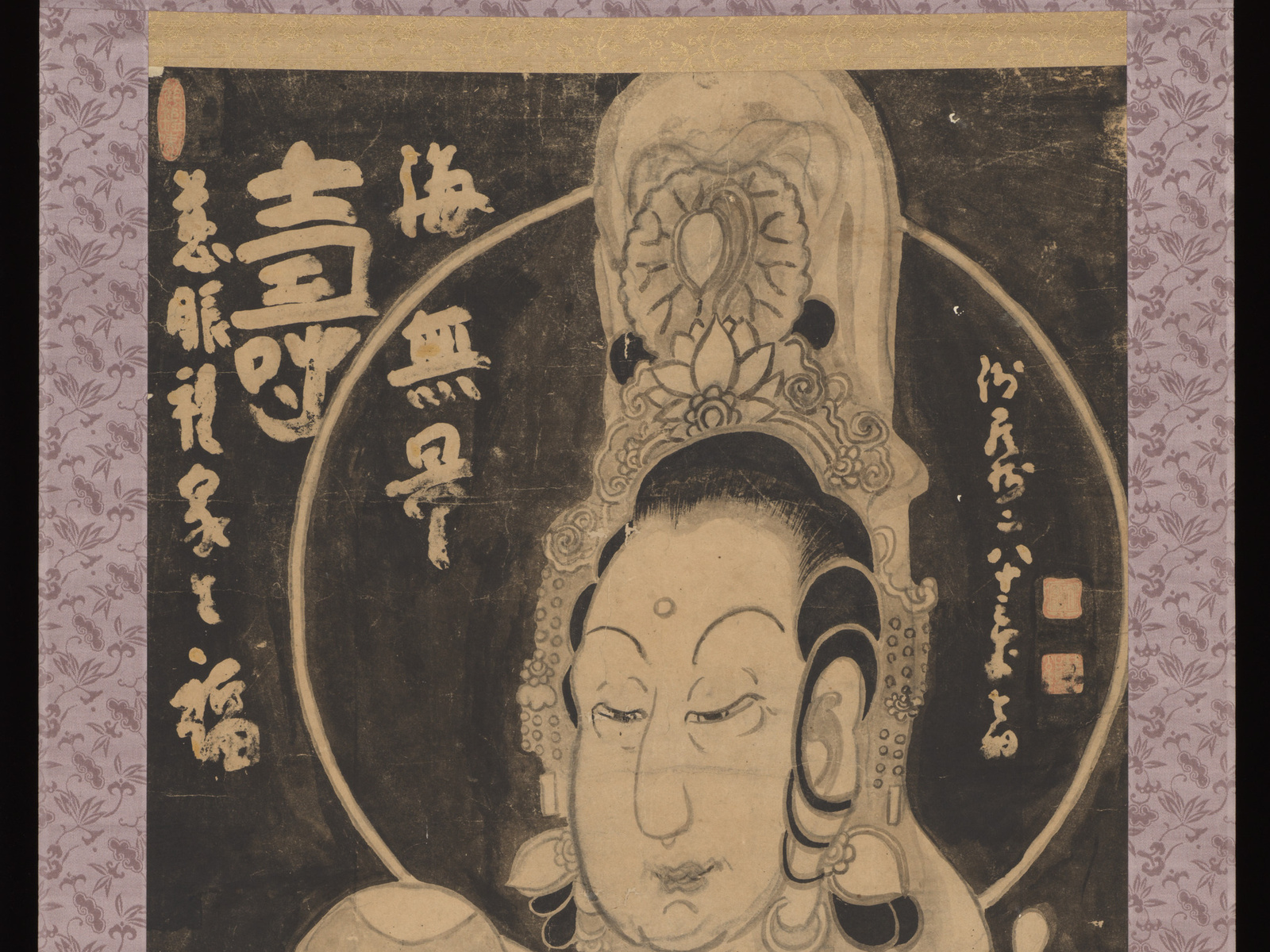 Kannon's complete crowned head and halo fill Hakuin Ekaku's bold ink painting above lotus forms.